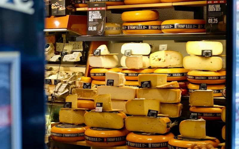 a display case filled with lots of cheese