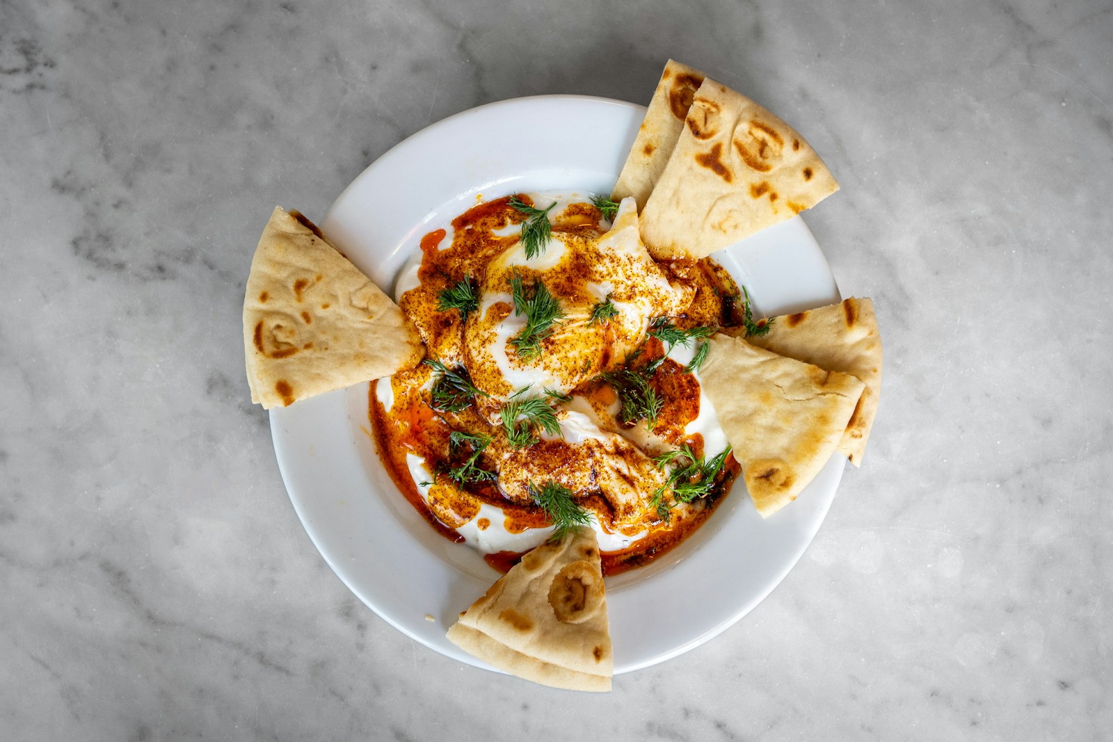 a plate of food with tortillas and cheese